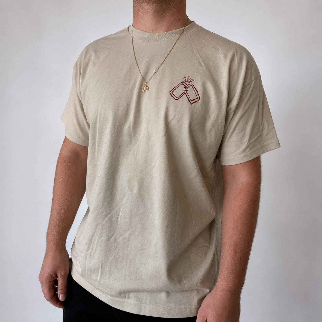 Just Some Grown-Up Kids t-shirt worn from the front, with the hand-drawn emblem on the chest
